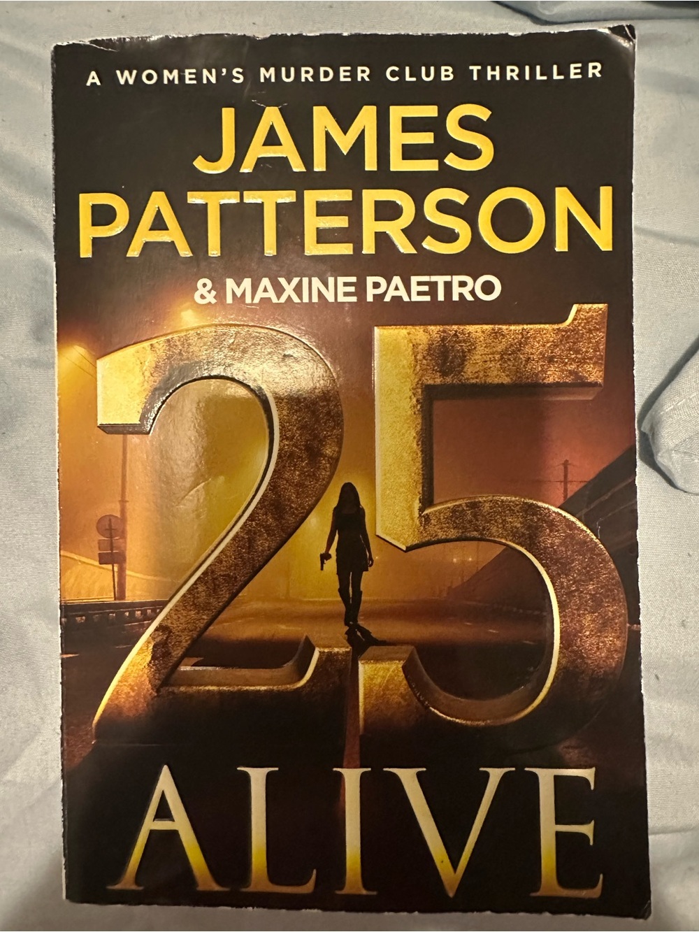 25 Alive by James Patterson - Thriller Paperback - Gold & Black Cover